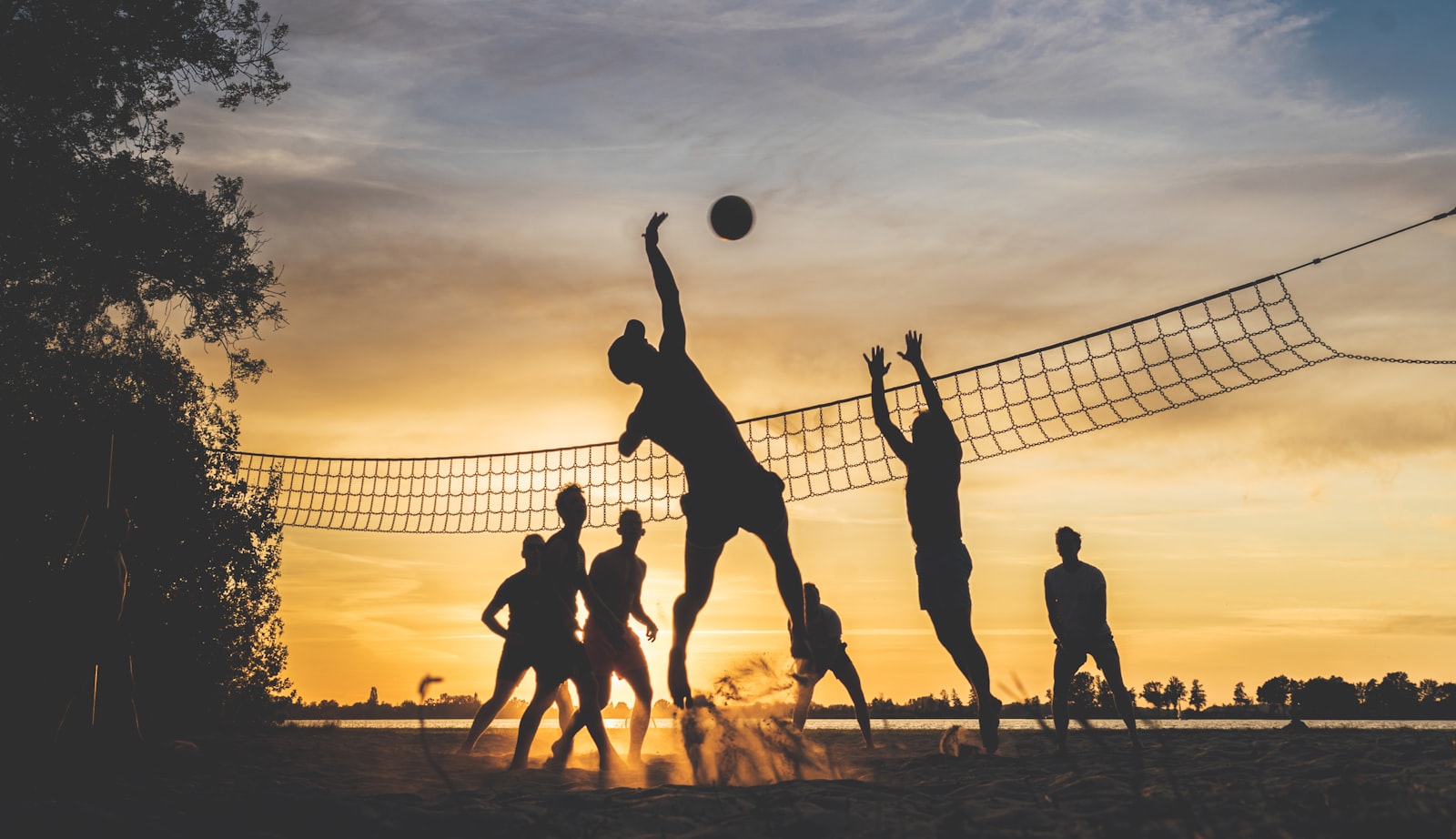 Youth sports team playing at sunset